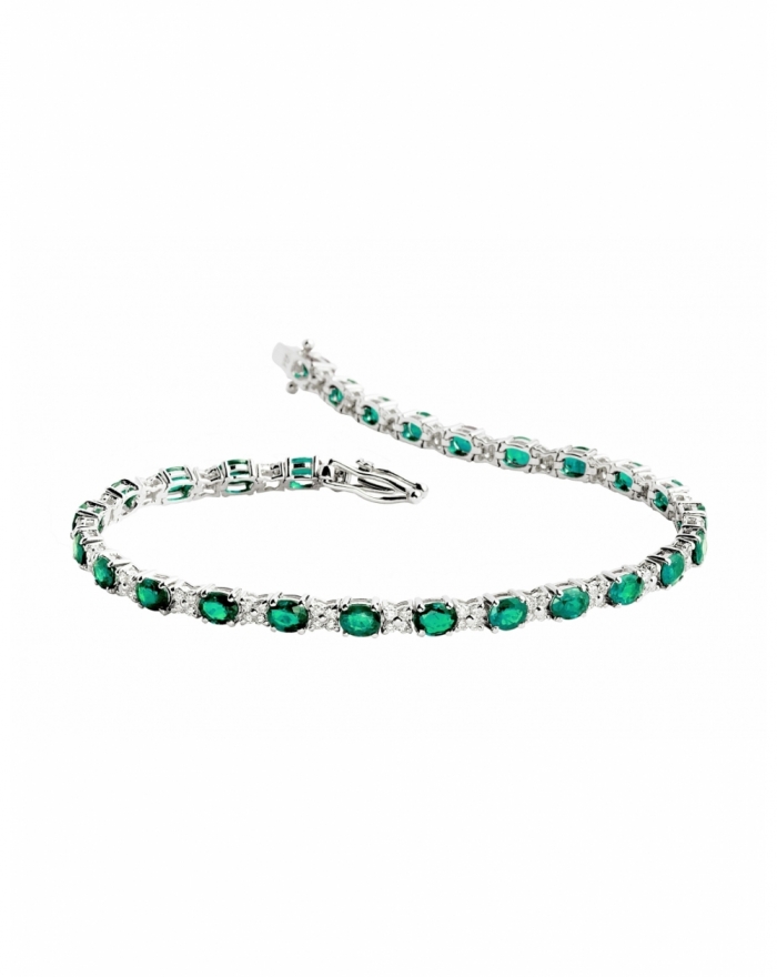White gold tennis with emeralds and flower diamonds